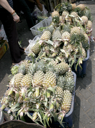 He also sells three big boxes of pineapple!